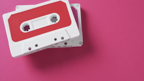Video-of-retro-tapes-with-copy-space-on-pink-background