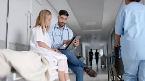 Young-Caucasian-girl-consults-with-a-doctor-in-a-hospital,-with-copy-space
