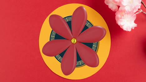 Animation-of-chinese-pattern-and-flowers-with-copy-space-on-red-background