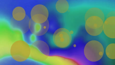 Animation-of-yellow-light-spots-over-colourful-shapes-on-blue-background