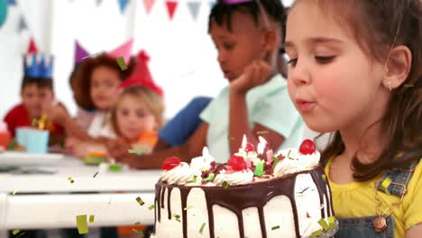 Animation-of-gold-confetti-falling-over-caucasian-girl-blowing-out-candles-on-cake-at-birthday-party