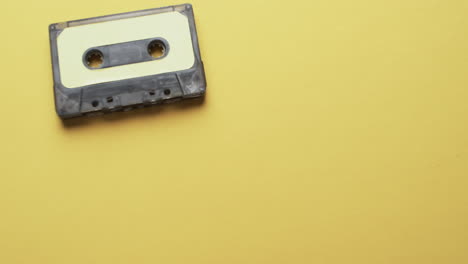 Video-of-retro-tape-with-yellow-label-with-copy-space-on-yellow-background