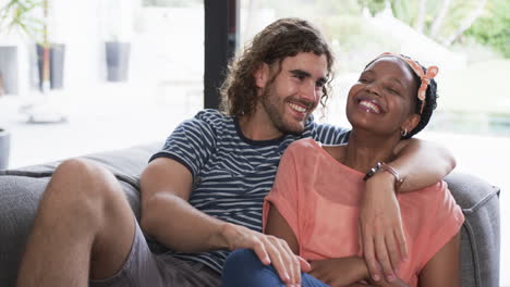 Diverse-couple-enjoys-a-cozy-moment-at-home