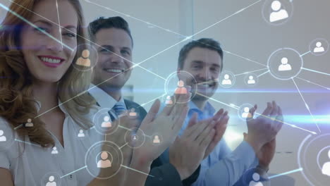 Animation-of-network-of-connections-over-diverse-colleagues-clapping-at-meeting-in-office