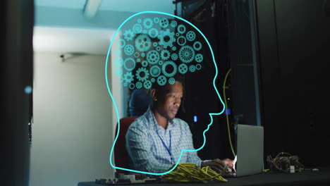 Animation-of-human-head-ai-data-processing-over-african-american-man-using-laptop