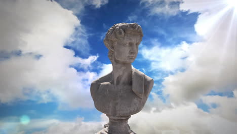 Animación-De-Una-Escultura-Gris-De-Un-Hombre-Sobre-Un-Cielo-Azul-Y-Nubes