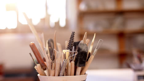 Box-with-pottery-tools-on-desk-in-pottery-studio