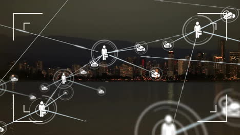 Animation-of-network-of-connections-with-people-icons-over-cityscape