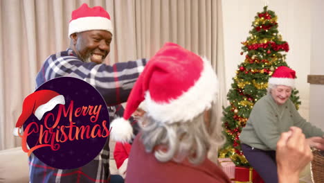Animation-of-merry-christmas-text-over-diverse-senior-friends-dancing-at-christmas-at-home