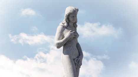 Animation-of-gray-sculpture-of-woman-over-blue-sky-and-clouds
