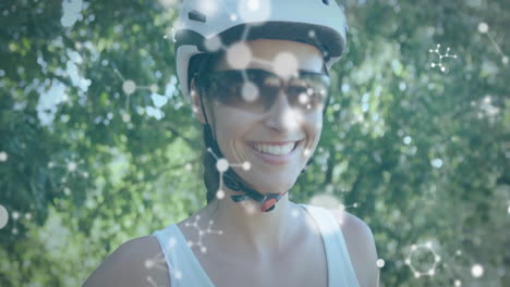 Animation-Chemischer-Modelle-über-Einer-Lächelnden-Kaukasischen-Frau,-Die-Auf-Der-Straße-Fahrrad-Fährt