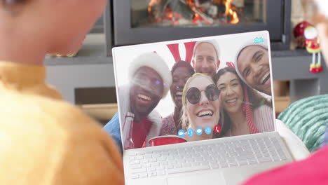 Happy-diverse-friends-having-christmas-laptop-video-call,-slow-motion