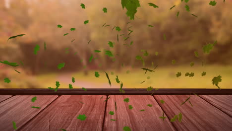 Animation-Von-Blättern,-Die-über-Eine-Holztischplatte-Und-Rasen-Und-Pflanzen-Im-Garten-Wehen