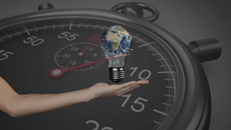 Animation-of-hand-with-light-bulb-and-planet-earth-over-stopwatch-ticking-on-black-background