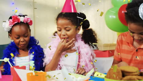 Animation-of-gold-confetti-falling-over-happy-diverse-girls-and-boy-eating-cake-at-birthday-party