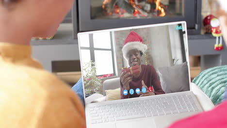 Happy-diverse-male-friends-having-christmas-laptop-video-call,-slow-motion