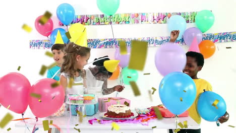 Animation-of-gold-confetti-falling-over-happy-diverse-girls-and-boys-celebrating-at-birthday-party