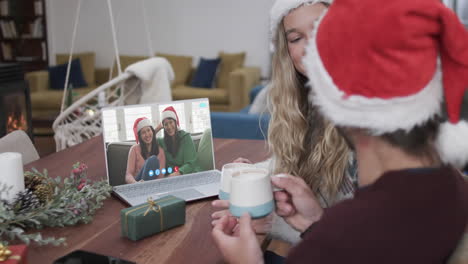 Happy-caucasian-couple-and-mother-and-daughte-having-christmas-laptop-video-call,-slow-motion
