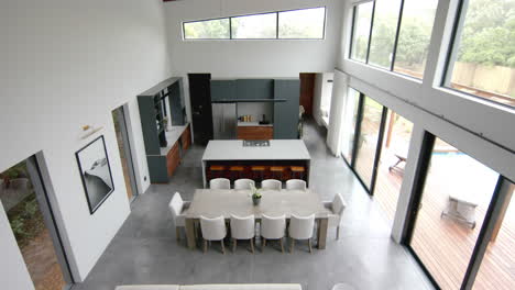 High-angle-view-of-open-plan-living-room,-dining-room-and-kitchen,-copy-space,-slow-motion