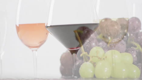 Composite-of-glasees-with-white,-rose-and-red-wine-glasses-over-grapes-on-white-background