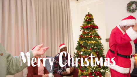 Animation-of-merry-christmas-text-over-diverse-senior-friends-dancing-at-christmas-at-home