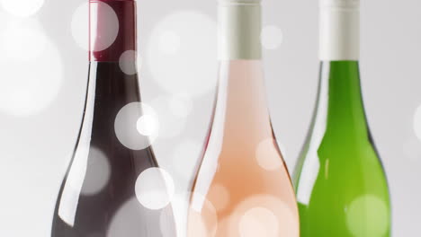 Composite-of-bottles-of-red,-rose-and-white-wines-on-white-background