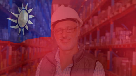 Animation-of-flag-of-taiwan-over-happy-senior-caucasian-male-worker-in-warehouse