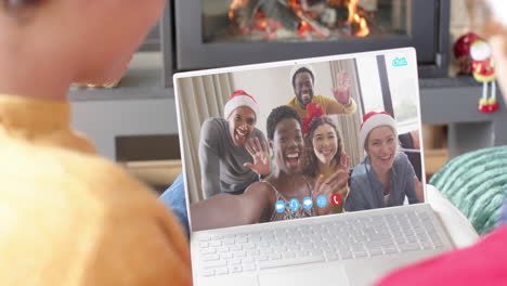 Happy-diverse-friends-having-christmas-laptop-video-call,-slow-motion