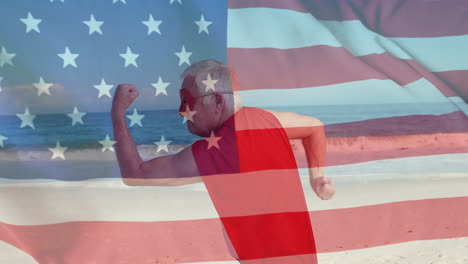 Animation-of-flag-of-usa-over-caucasian-superhero-man-on-beach-in-summer