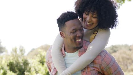 Happy-african-american-couple-embracing-in-garden-at-home,-slow-motion