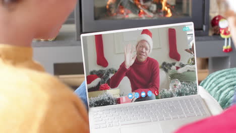 Happy-diverse-male-friends-having-christmas-laptop-video-call,-slow-motion