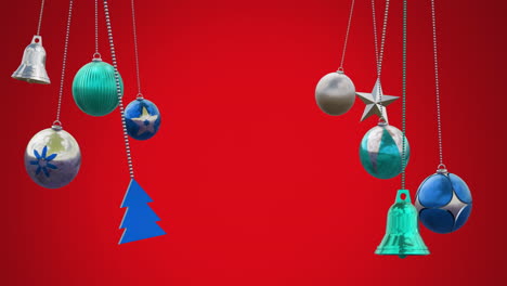 Animation-of-baubles,-bells,-tree-and-star-hanging-against-red-background