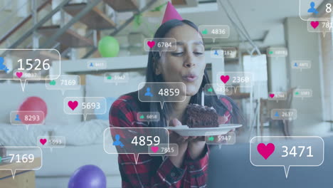 Animation-of-social-media-data-processing-over-biracial-woman-with-birthday-cake