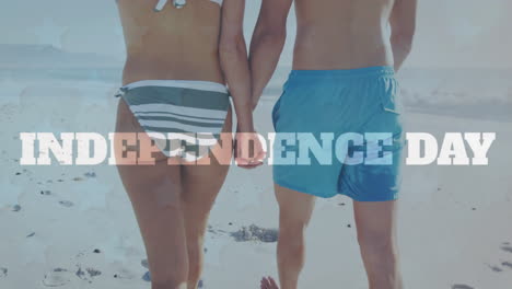 Animation-of-independence-day-the-over-caucasian-couple-holding-hands-walking-on-sunny-beach