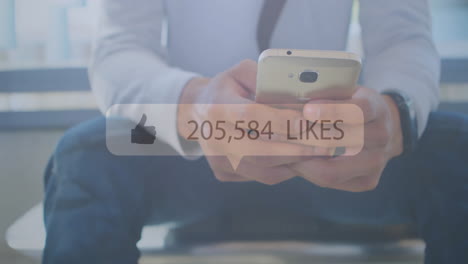 Animation-of-likes-text-with-growing-number-over-caucasian-man-using-smartphone