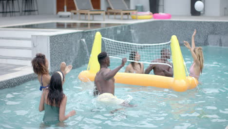 Diverse-group-enjoys-a-playful-game-in-a-pool