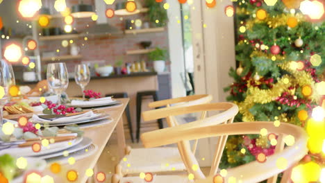 Animation-of-fairy-lights-over-table-set-for-christmas-dinner-at-home