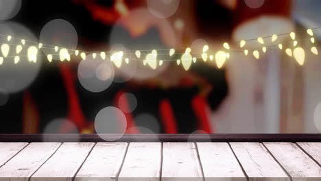 Animation-Von-Lichtpunkten-über-Weihnachtlichen-Lichterkettendekorationen