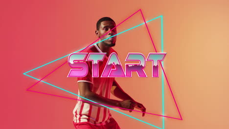 Animation-Des-Starttextes-Mit-Formen-über-Einem-Afroamerikanischen-Fußballspieler,-Der-Einen-Ball-Tritt