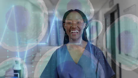 Animation-of-cells-and-data-processing-over-african-american-female-doctor-in-hospital