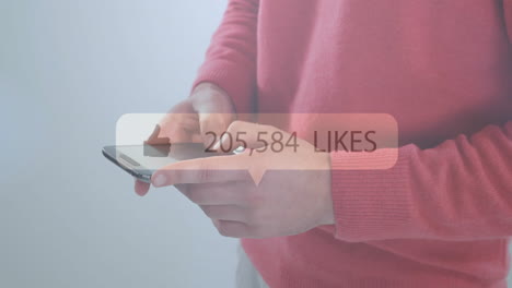 Animation-of-likes-text-with-growing-number-over-caucasian-man-using-smartphone