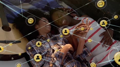 Animation-of-network-of-connections-with-icons-over-diverse-couple-in-car