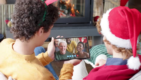 Happy-diverse-friends-having-christmas-tablet-video-call,-slow-motion