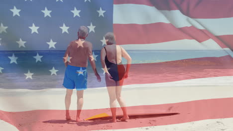 Animation-of-flag-of-usa-over-caucasian-senior-couple-on-beach-in-summer