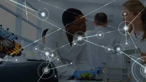 Animation-of-network-of-connections-over-diverse-female-scientists-taking-sample-in-lab