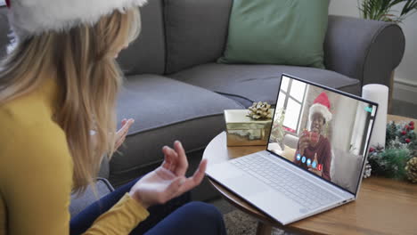 Happy-diverse-male-and-female-friends-having-christmas-laptop-video-call,-slow-motion