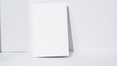 Video-of-book-with-blank-white-pages-and-copy-space-on-white-background