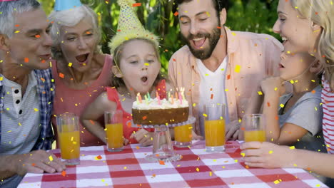 Animation-of-confetti-over-happy-caucasian-grandparents,-parents-and-children-celebrating-birthday