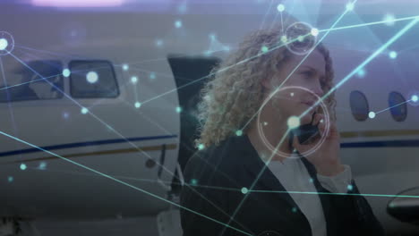 Animation-of-network-of-connections-caucasian-businesswoman-with-smartphone-by-plane