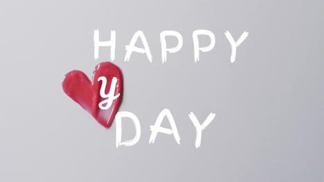 Animation-of-happy-heart-day-text-over-white-background